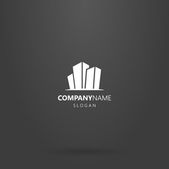 white logo on a black background. simple flat art cartoon logo of three high-rise buildings
