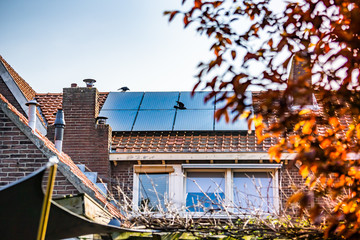 Waalwijk, Noord Brabant, Netherlands - Solar panels on the roof of a house for green power and a...
