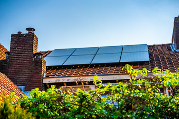 Waalwijk, Noord Brabant, Netherlands - Solar panels on the roof of a house for green power and a better environment.