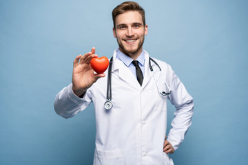 healthcare and medical concept - male doctor with heart. - obrazy, fototapety, plakaty