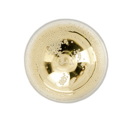 Glass of champagne on white background, top view. Festive drink