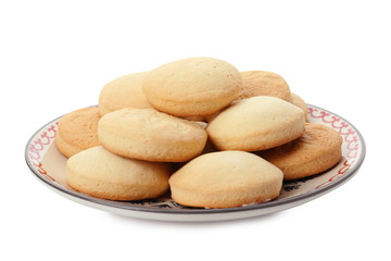 Fototapeta na wymiar Plate with cookies for Islamic holidays isolated on white. Eid Mubarak