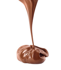 Pouring sweet chocolate cream on white background