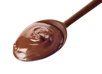 Wooden spoon with sweet chocolate cream on white background