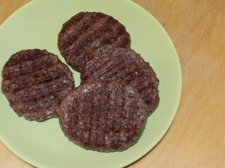Steak on a light green plate close up