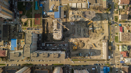Directly above view of construction of modern high-rise buildings. Phased construction of structures.