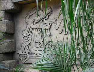 Mayan bas-relief. the dragon exhales steam from the mouth. modern copy