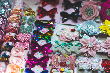 Fototapeta premium flowers hairpins for girls of different bright spring flowers in stock