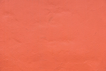 Seamless orange painted concrete wall, copy space