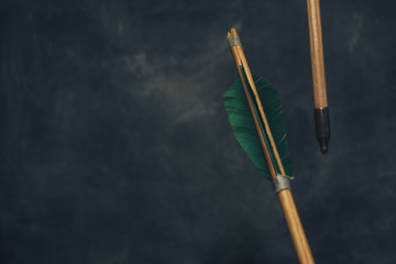 Wood arrow. Beautiful  background. Medieval weapons are handmade.