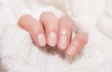Beige nails on white background