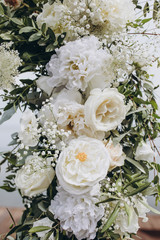 arrangement of white flowers and greenery