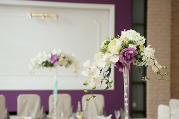 wedding decorations from flowers in purple tone. Banquet room decorated for the holiday