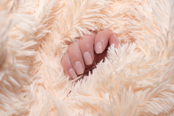 sexy beige manicure on a musky beige background