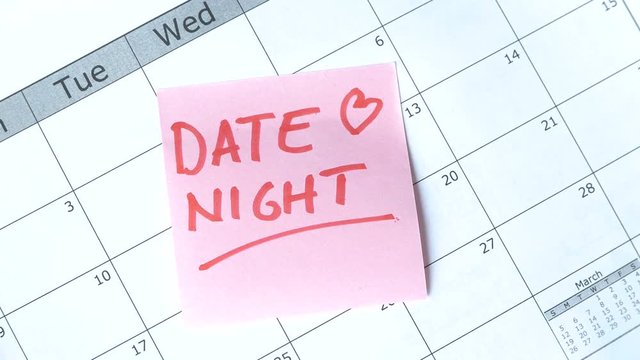 Posting a reminder with DATE NIGHT written on it.