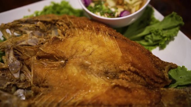 Deep Fried Snapper topped with Sweet Fish Sauce.
