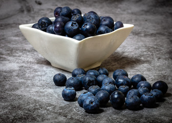 Blueberries in bowl with cutlery