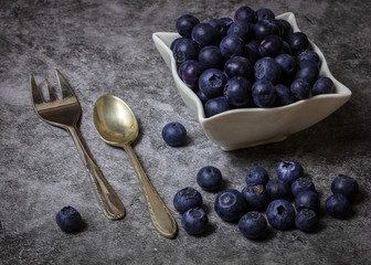 Blueberries in bowl with cutlery