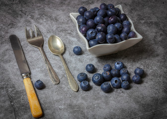 Blueberries in bowl with cutlery