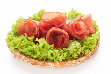 Sandwich with salami sausage on white background.