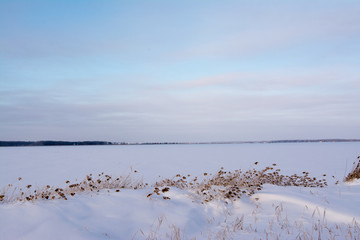 winter view of the polar industrial russian city surrounded with snow mountains trees and slopes of snowmobile