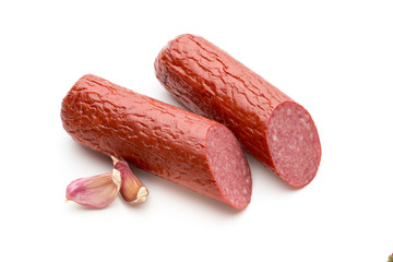 Salami smoked sausage, basil leaves on white background cutout.