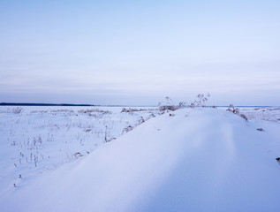 winter view of the polar industrial russian city surrounded with snow mountains trees and slopes of...