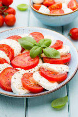 Classic caprese salad. Mozzarella tomatoes and  Basilikum.