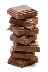 Milk organic chocolate pieces isolated on white background