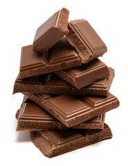 Milk organic chocolate pieces isolated on white background