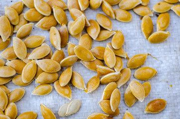 Macro background texture of green pumpkin seeds