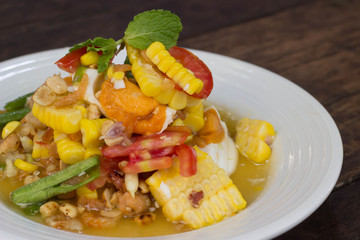 Spicy papaya salad with corn, salted eggs