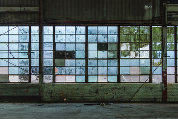 Blue tinted windows in an abandoned brick factory