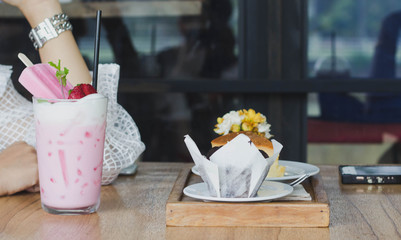 Coffee time,Pink milk and cake on the table
