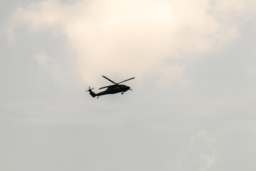Fototapeta na wymiar Helicopter flying in the sky.