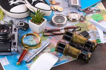 items and accessories for the traveler on the old background on the table