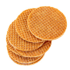 Pile of caramel  round Dutch waffles isolated on white background. Top view