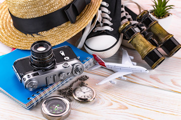 items and accessories for the traveler on the old background on the table