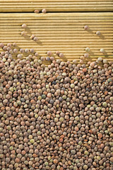Heap of lentil  background on wooden  surface,  healthy food