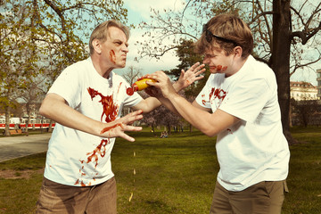 Men in street park fighting after eating langos with garlic, ketchup and cheese