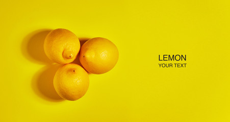Creative layout made of lemon on yellow background. Flat lay, top view, copy space . Food concept.