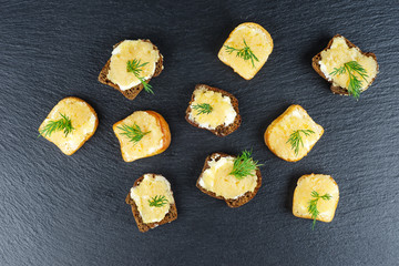 Bread pieces with delicious cod caviar on white background