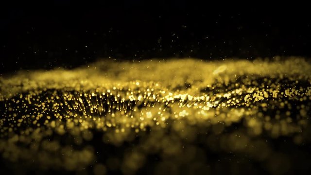 4k Abstract rendered Particles gold glitter on black background.