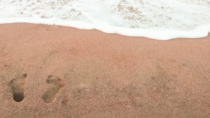 Footprints in the sand. Finike, Near Antalya, Turkey. Shoot in July 2018