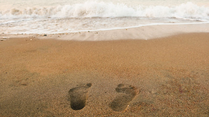 Footprints in the sand. Finike, Near Antalya, Turkey. Shoot in July 2018