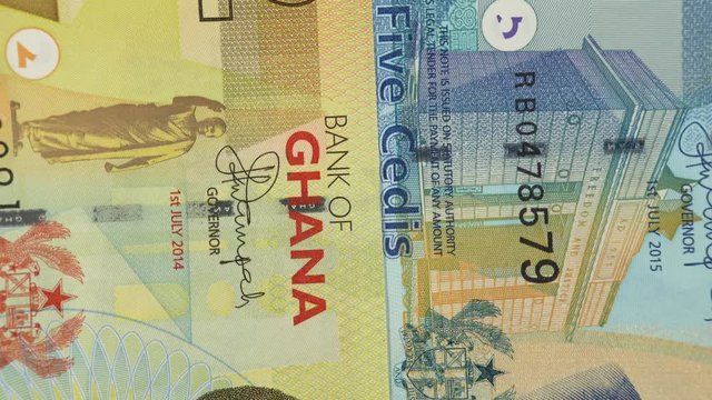 Ghana cedi banknotes rotating. Ghanaian currency, money. 4K stock video footage