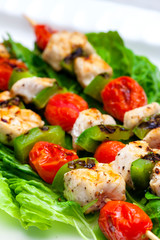 still life of meat skewers