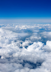 beautiful blanket of clouds from above with blue sky