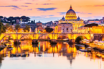 Fototapeta na wymiar Vatican City. Saint Peter Basilica and Sant'Angelo Bridge, over Tiber river. Rome, Italy.