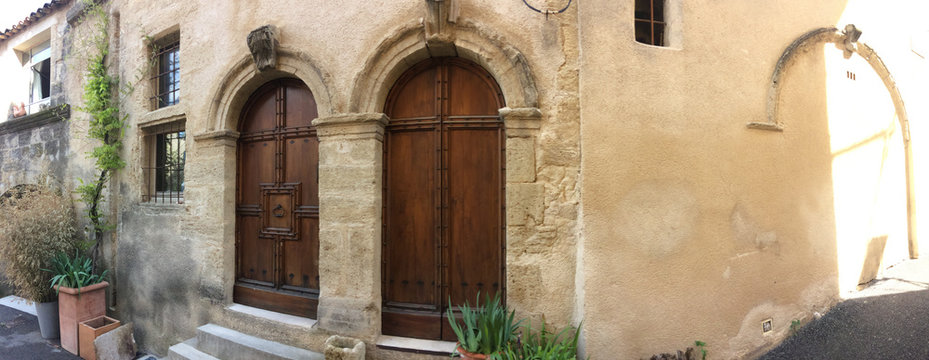 entrance of an ancient house with carved stones
